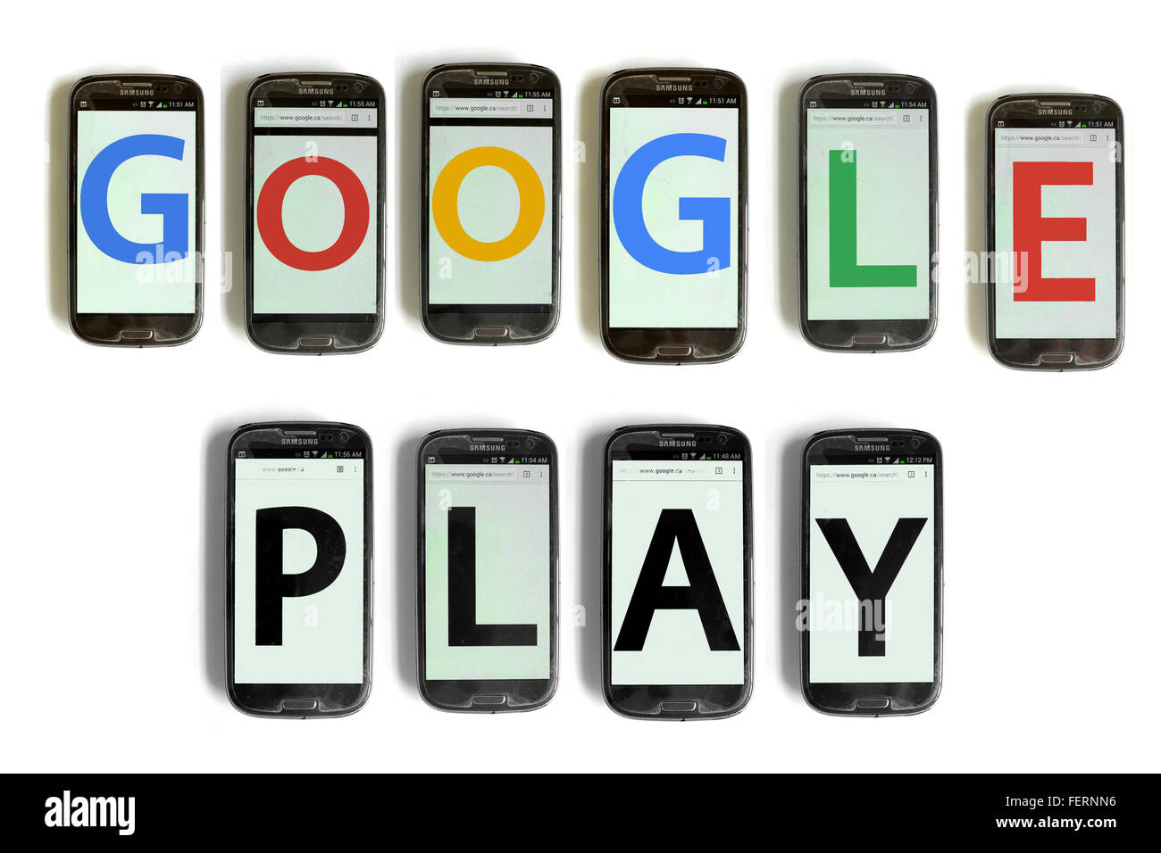 Google Play on the screens of smartphones photographed against a white background. Stock Photo