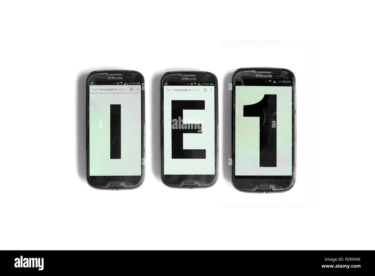 IE1 on the screens of smartphones photographed against a  white background. Stock Photo