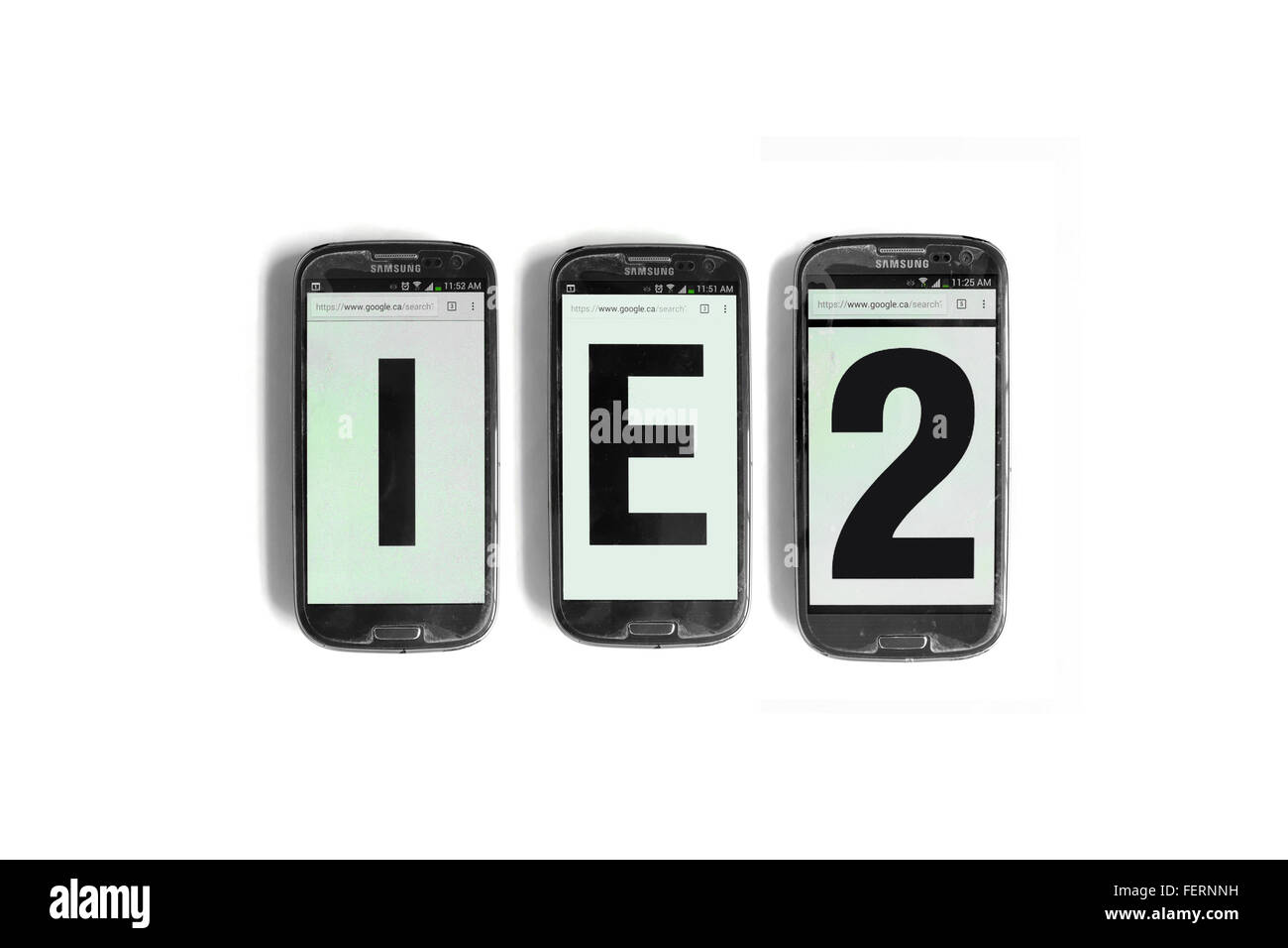 IE2 on the screens of smartphones photographed against a  white background. Stock Photo