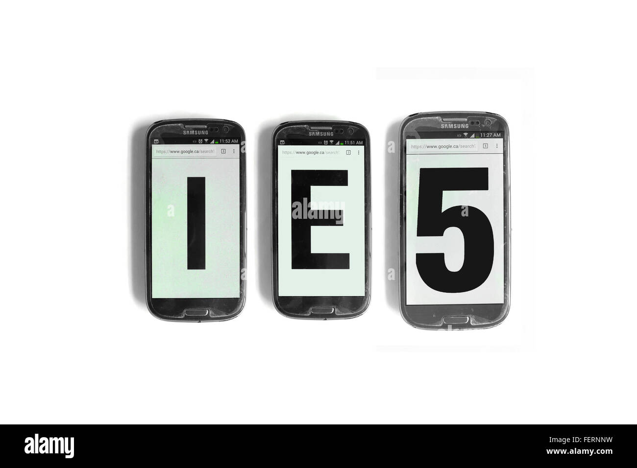 IE5 on the screens of smartphones photographed against a  white background. Stock Photo