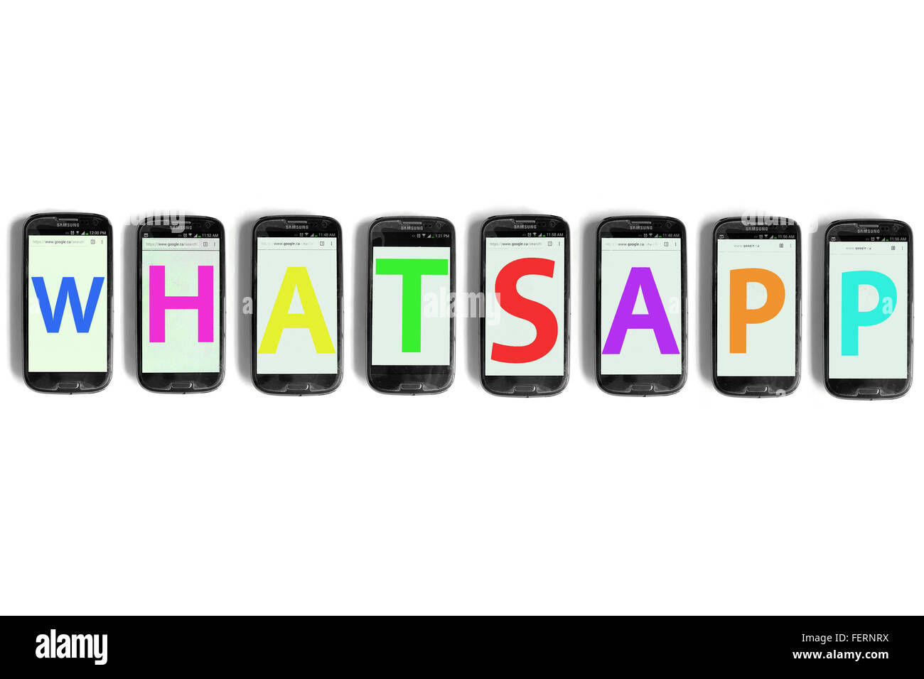 Whatsapp on the screens of smartphones photographed against a white background. Stock Photo