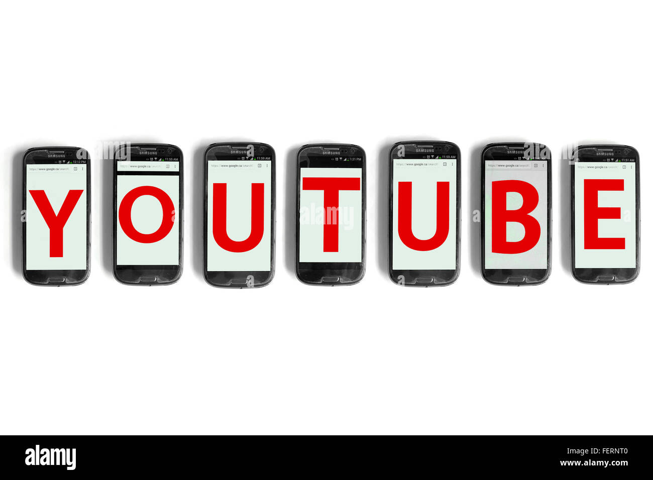 Youtube on the screens of smartphones photographed against a white background. Stock Photo