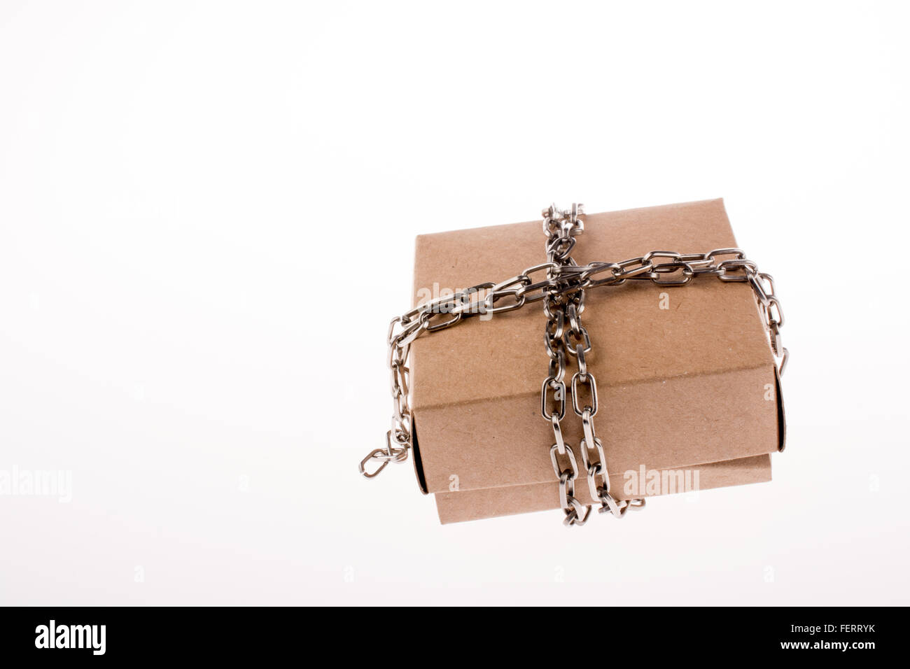 Cardboard Box in chains on a white background Stock Photo - Alamy
