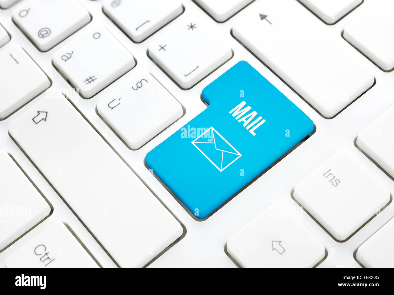 Web Mail network business concept, blue enter button or key on white keyboard photography. Stock Photo