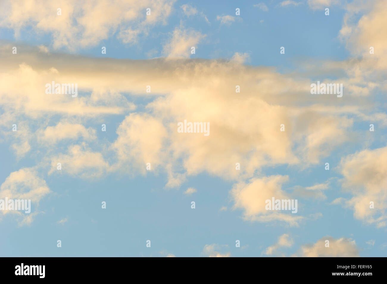 Clouds is an detailed image of cumulus clouds clouds floating in a blue daytime sky. Stock Photo