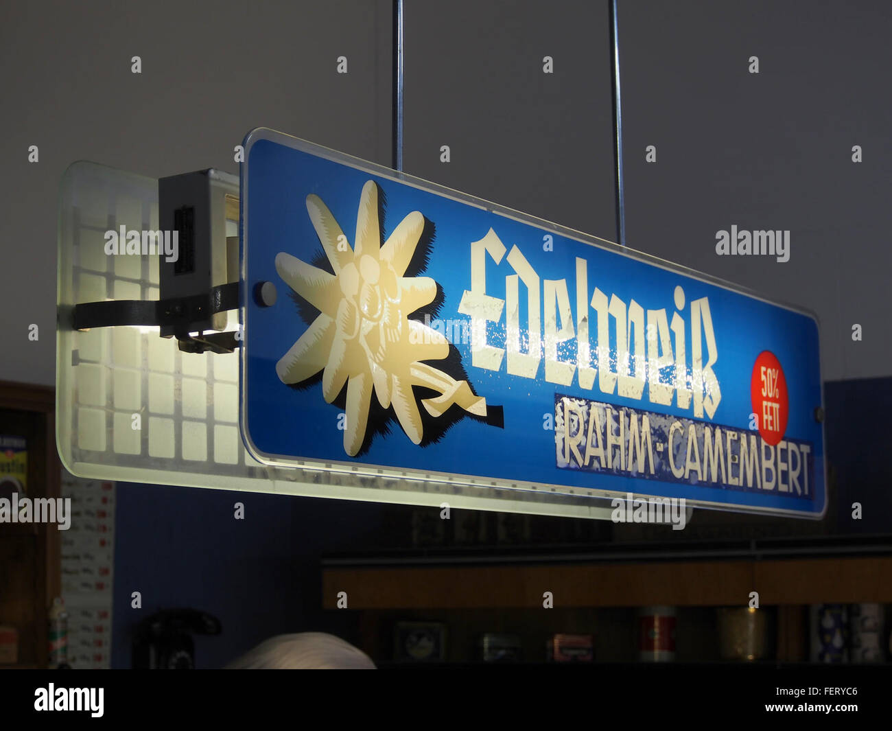 Edelweiss rahm-camembert, luminous advertising sign, Auto & Uhrenwelt Schramberg, pic1 Stock Photo