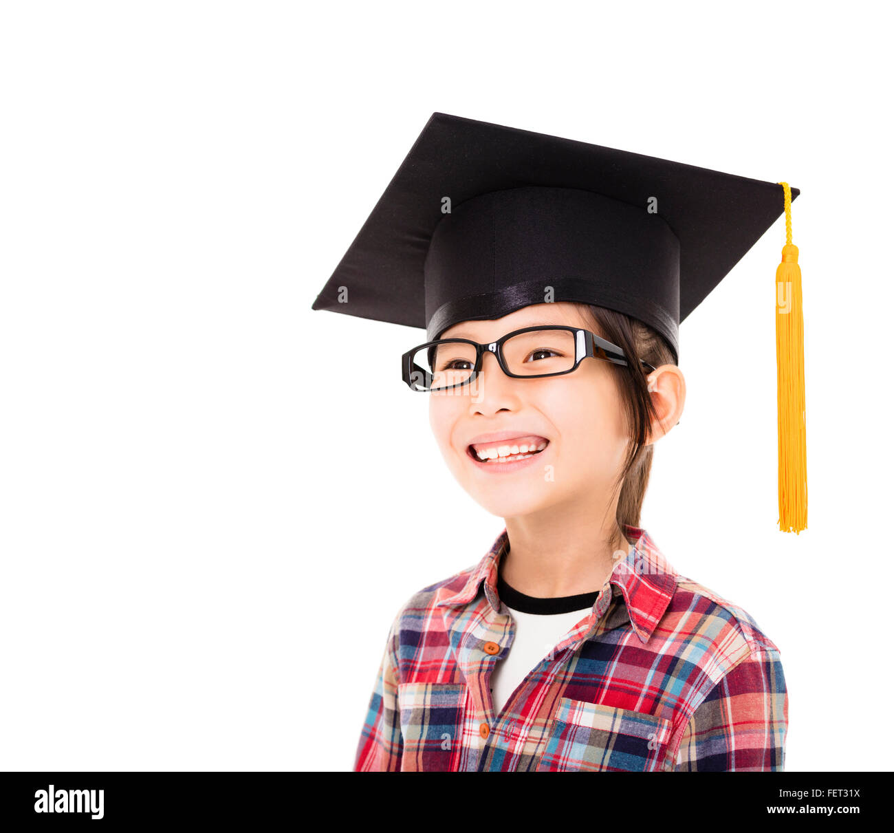 happy school kid graduate in graduation cap Stock Photo