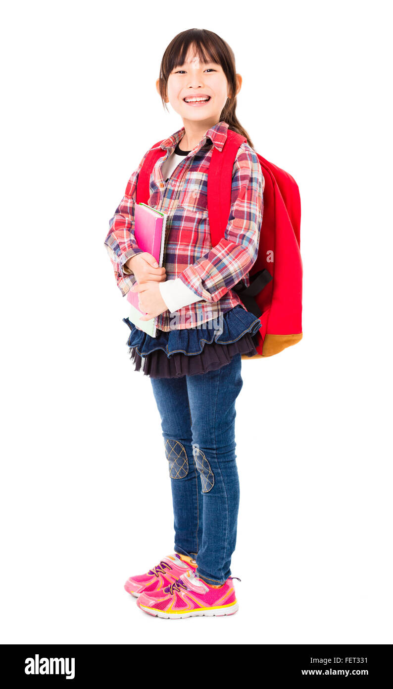 full length of smiling little girl holding books Stock Photo - Alamy