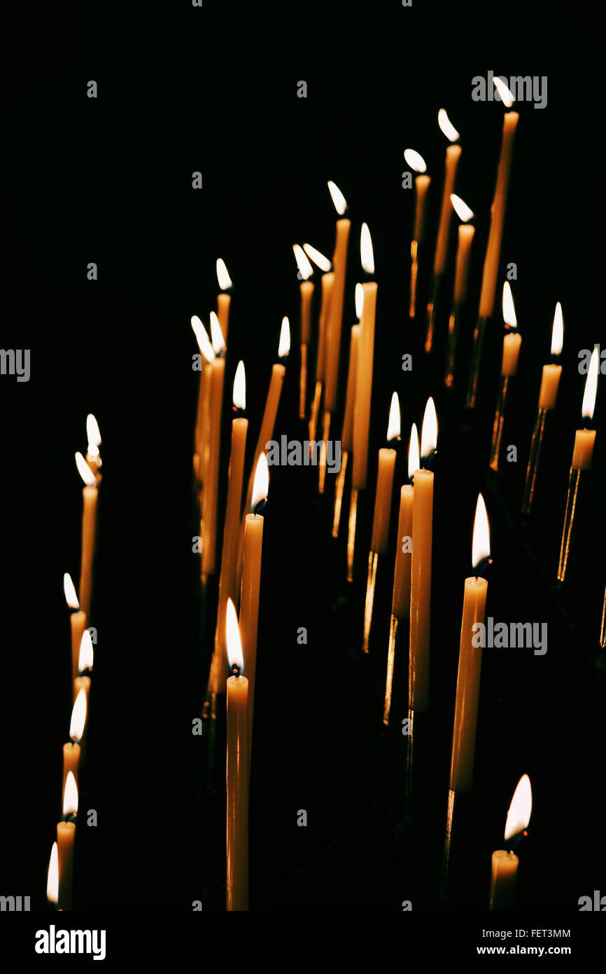 Lit Candles In Dark Room Stock Photo Alamy