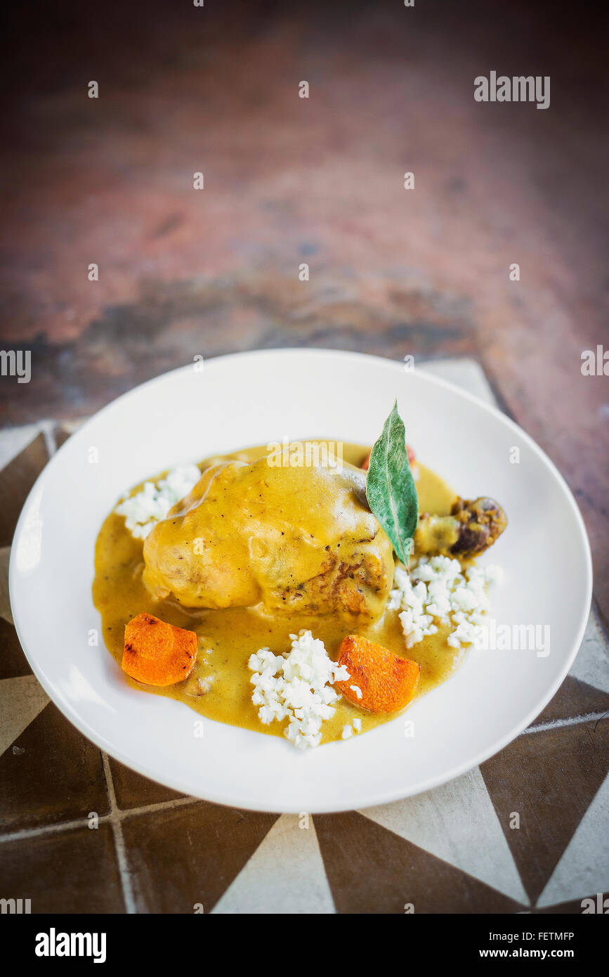 modern fusion spicy chicken yellow curry with vegetables Stock Photo