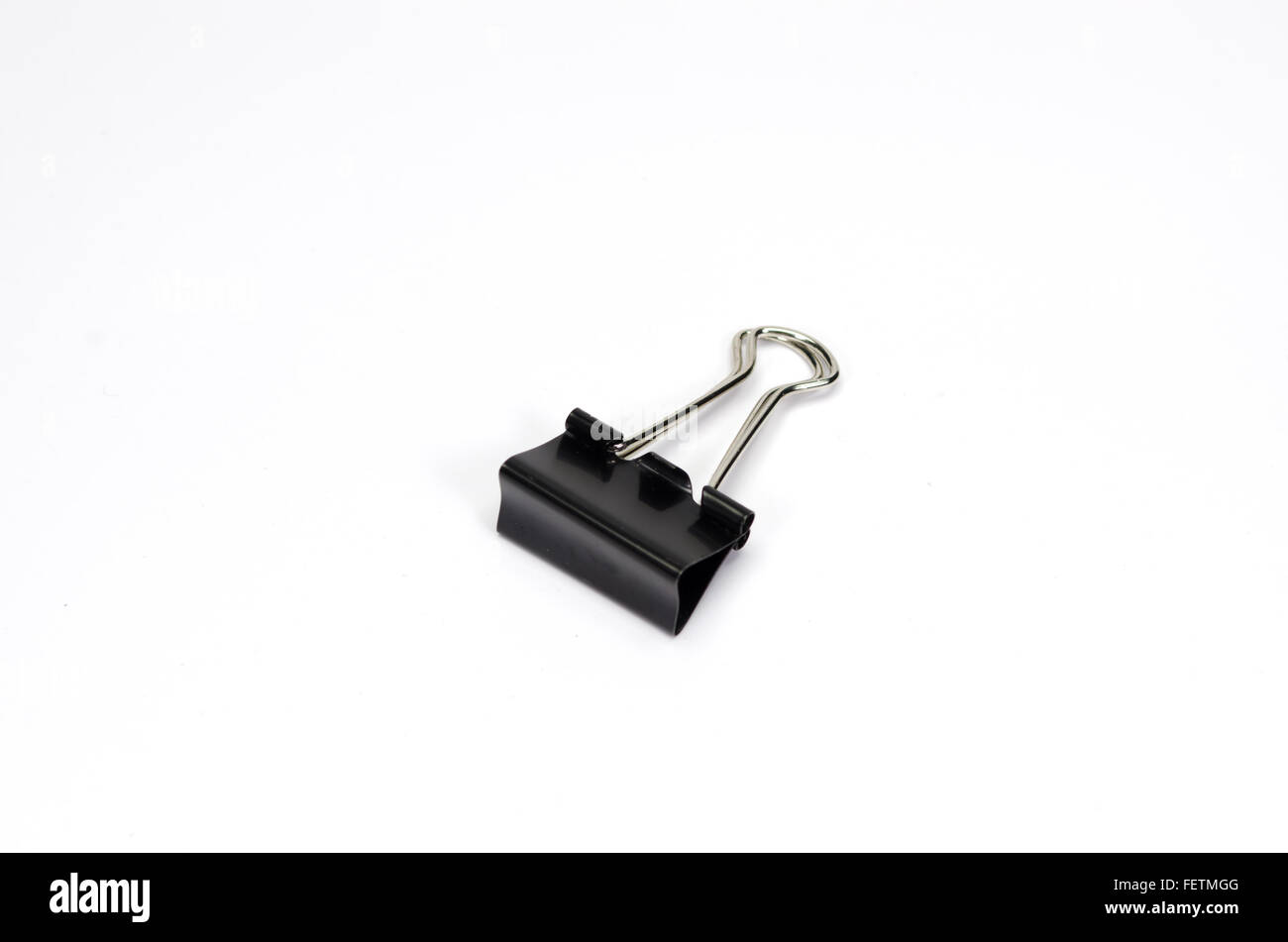 Black paper clip  isolated on white background. Stock Photo