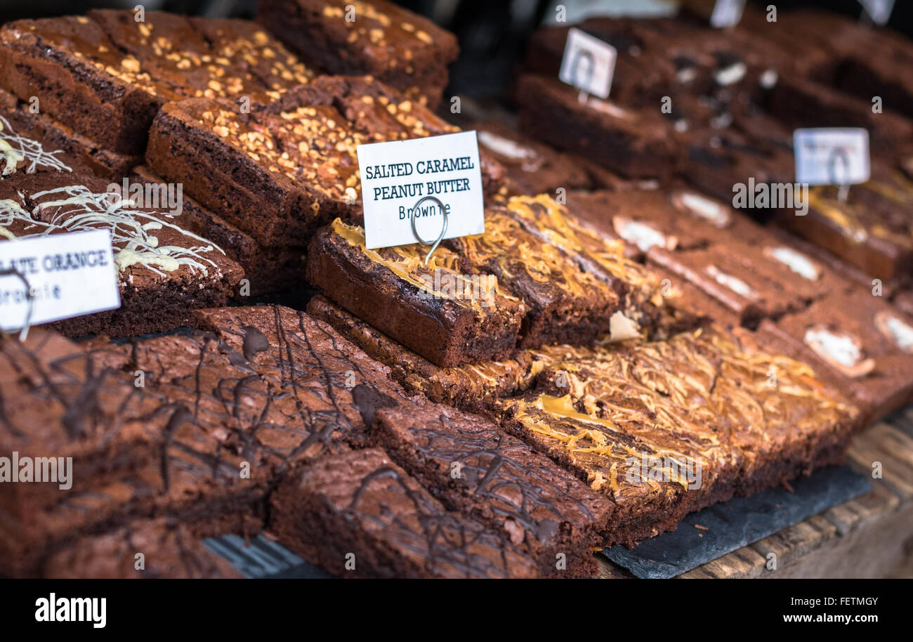 A selection of various delicious chocolate brownies for sale at a