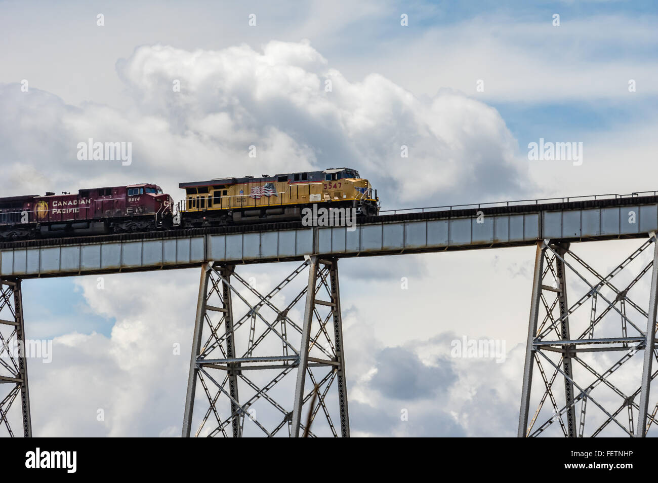 Freight train crossing a tall metal trestle near LaCrosse, Washington