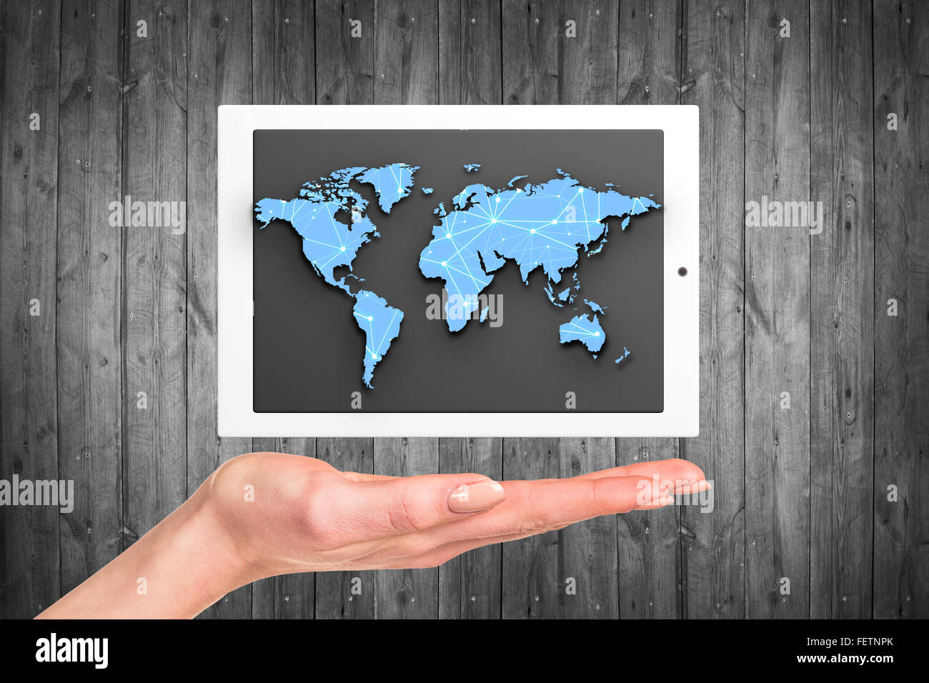 Tablet with world map Stock Photo