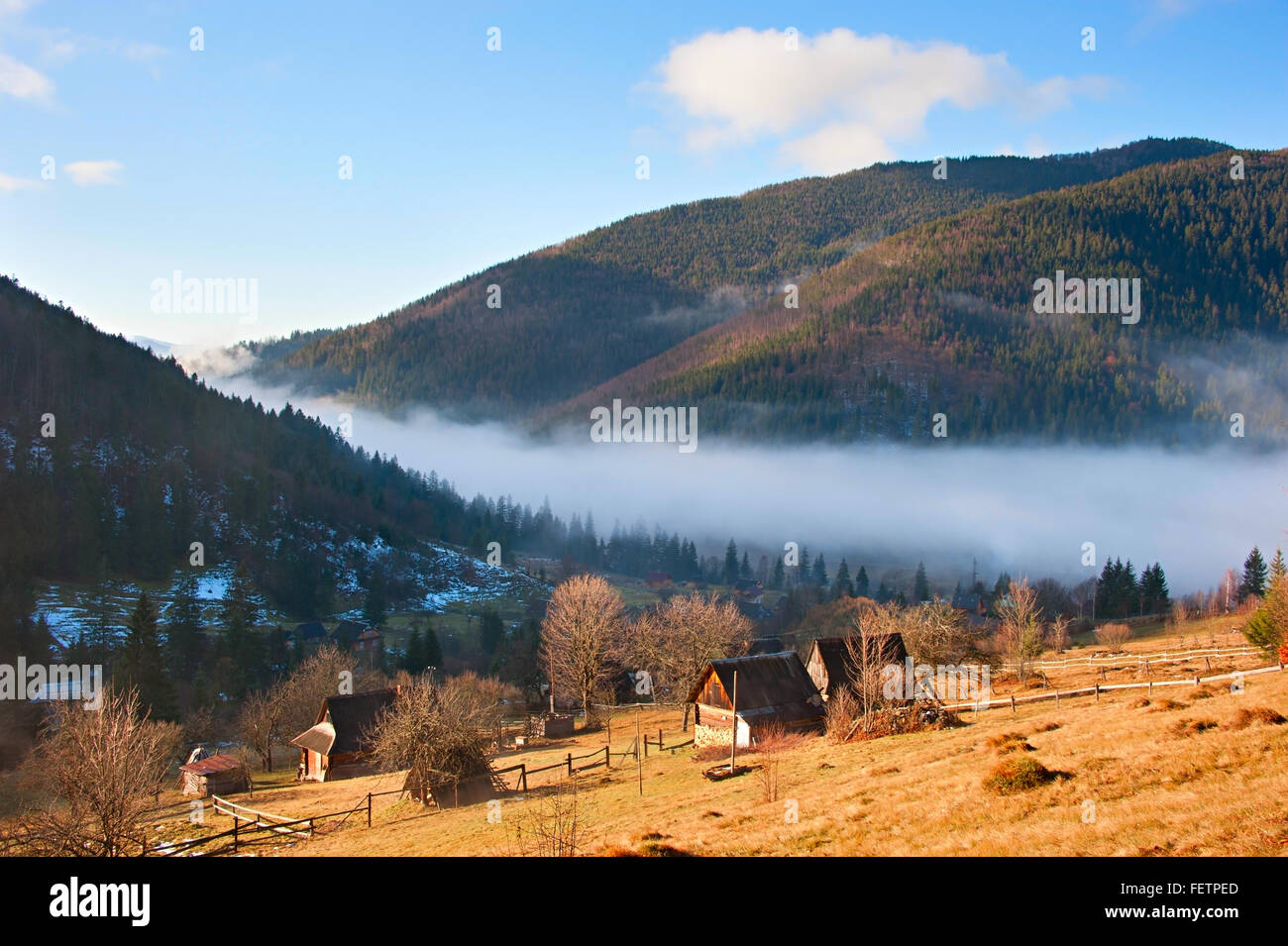 View of Carpathians mountains village in a morning mist Stock Photo - Alamy