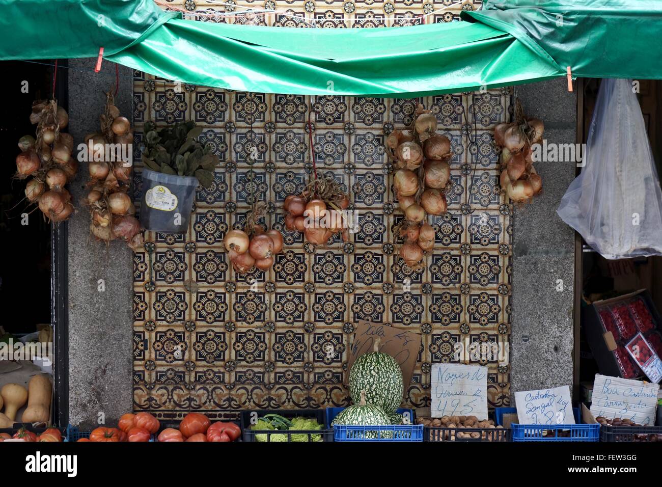 Onions hanging for sale outside a shop Stock Photo