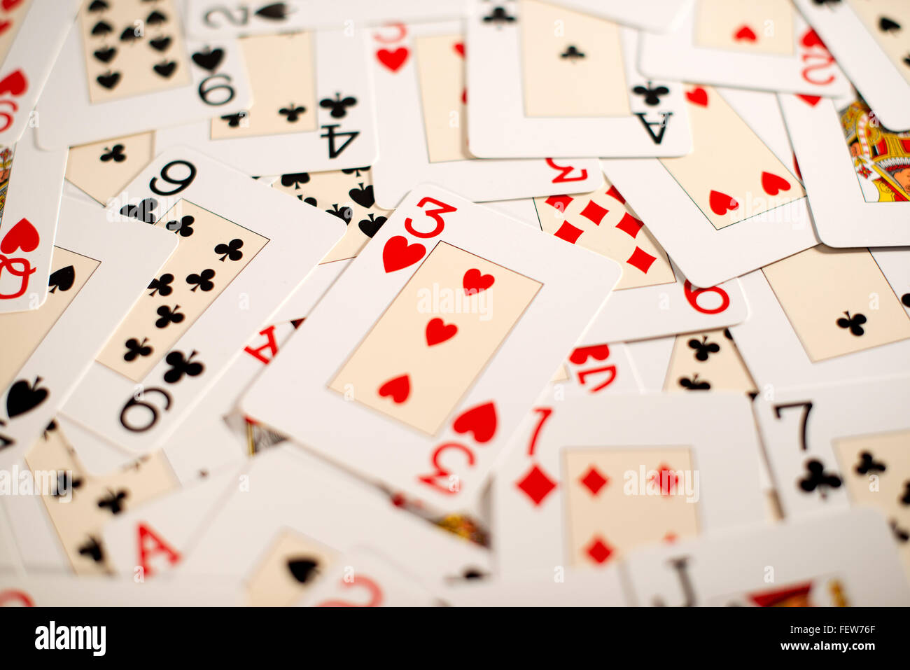 Background of a random spread of playing cards Stock Photo
