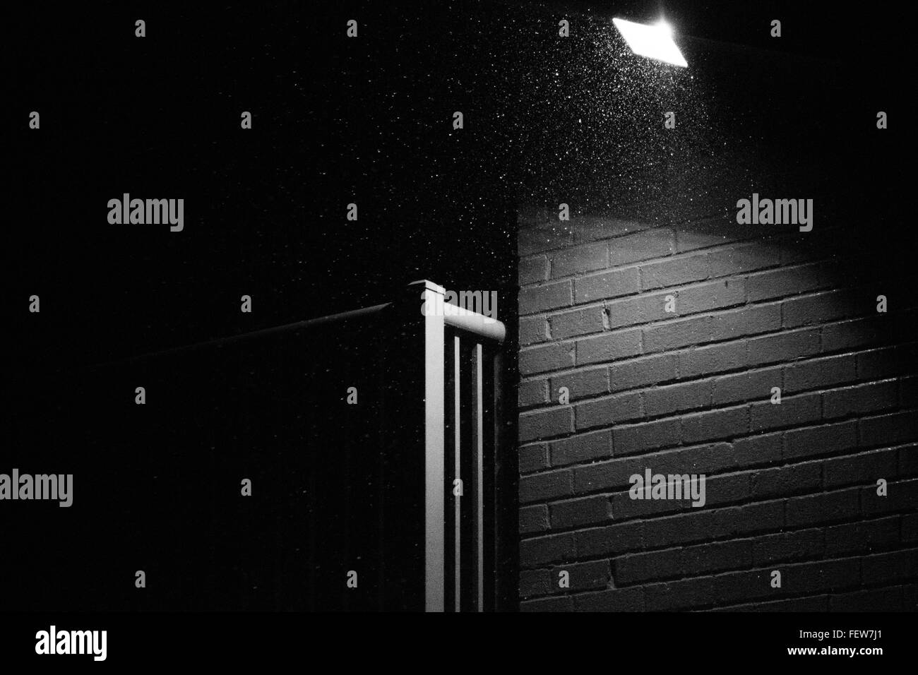 Black  & White photograph of a rainy night on a balcony. Stock Photo