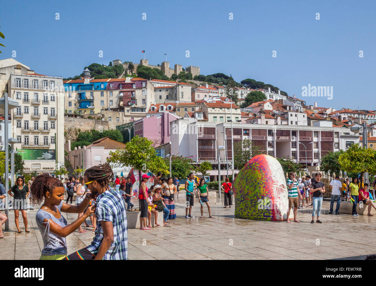 Portugal, Lisbon, Largo Martim Moniz is a popular meeting place below the hilltop fortification Castelo de Sao Jorge Stock Photo