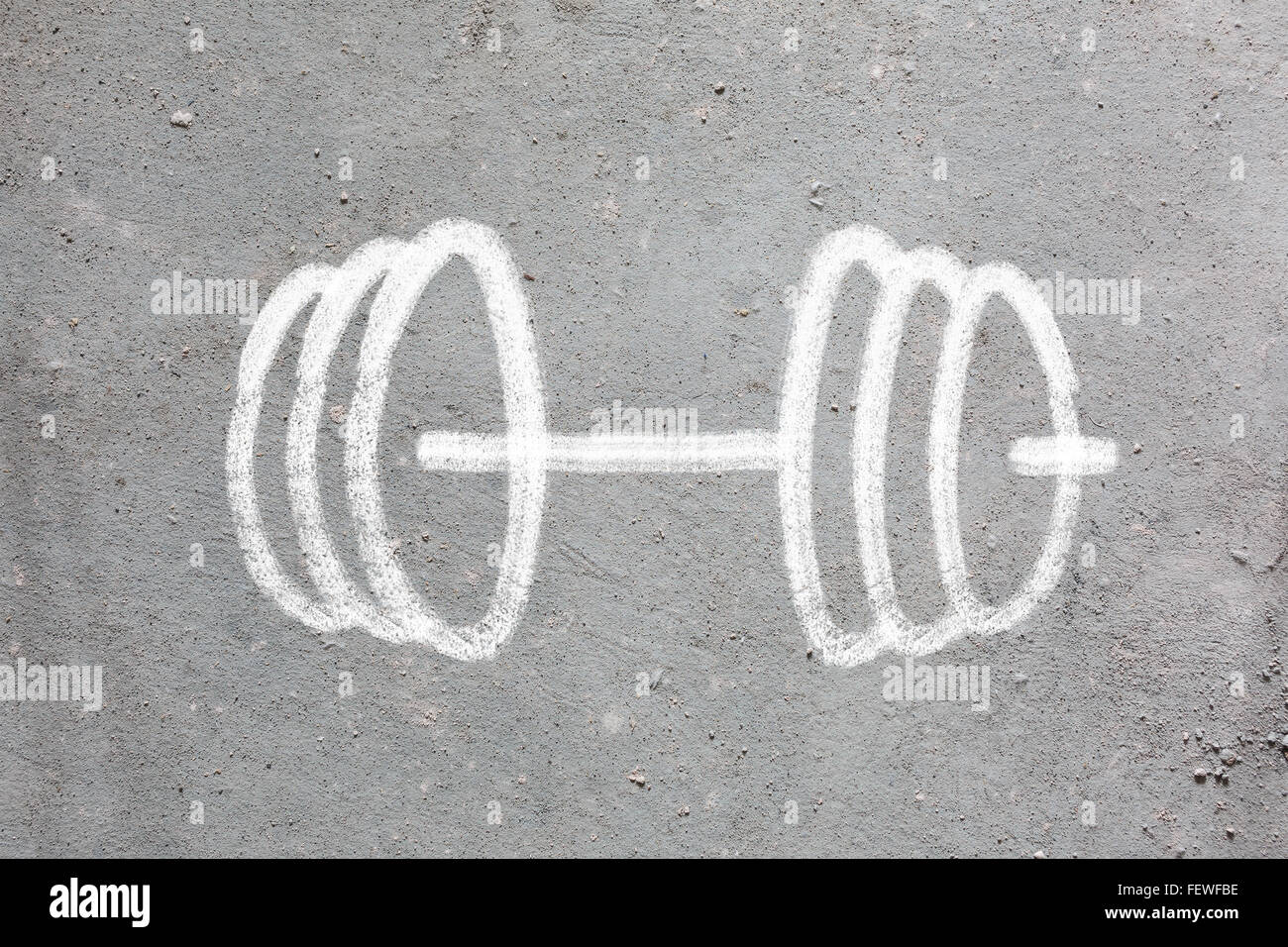 Barbell drawn on the gray wall Stock Photo