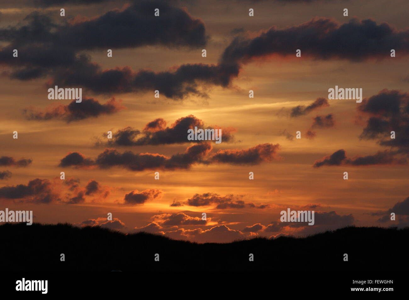 Low Angle View Of Cloudy Sky During Sunset Stock Photo