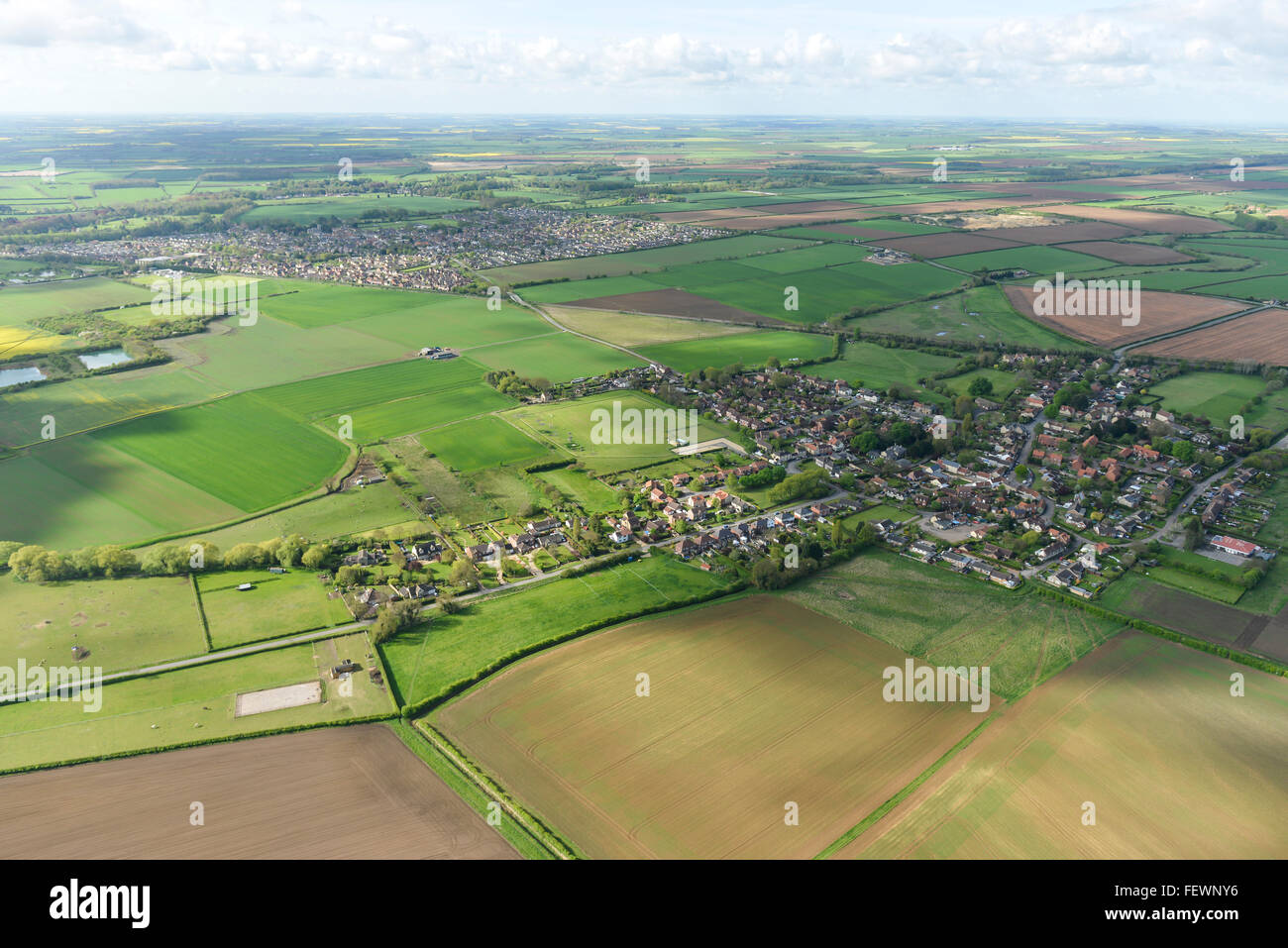 An aerial view of the Lincolnshire village of Dunston with Metheringham visible in the distance Stock Photo