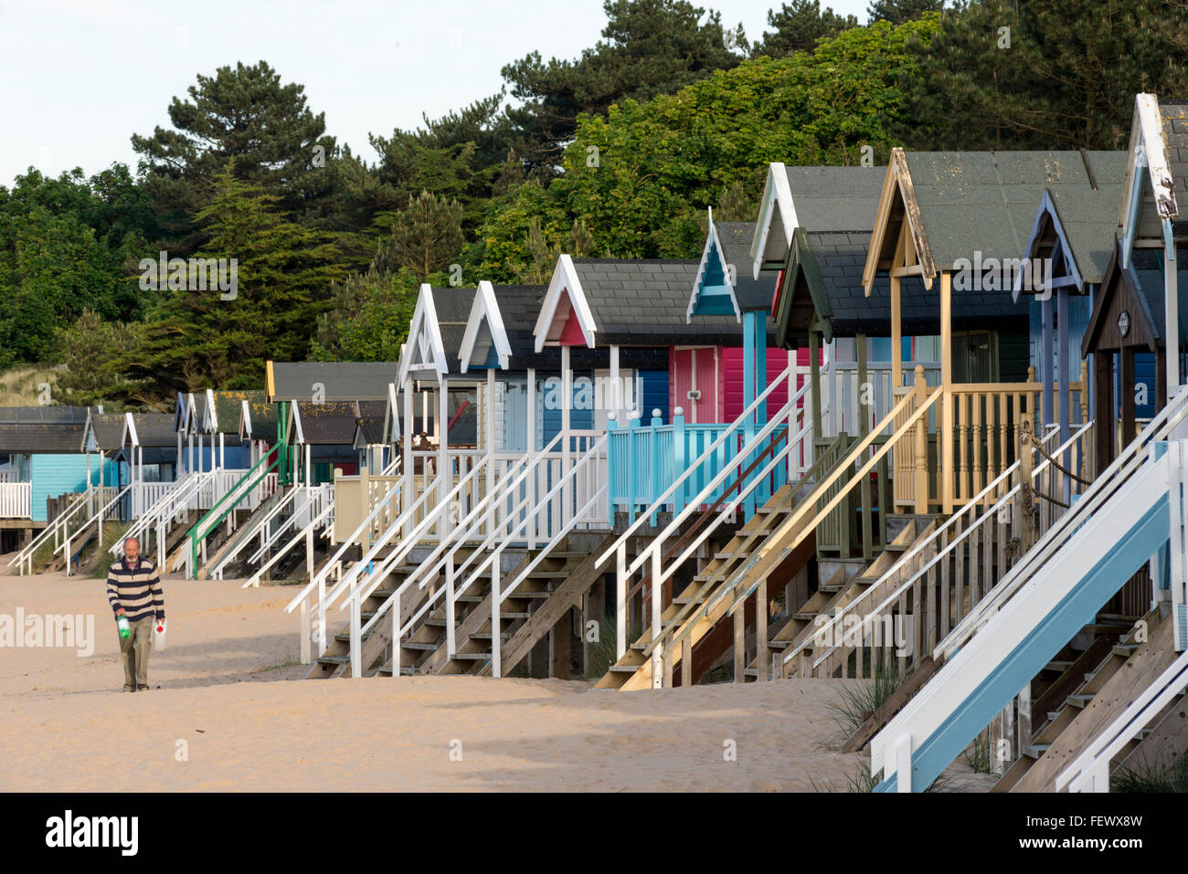 Colourful wooden beach huts on sandy beach of Wells next-the-Sea, Norfolk, UK Stock Photo