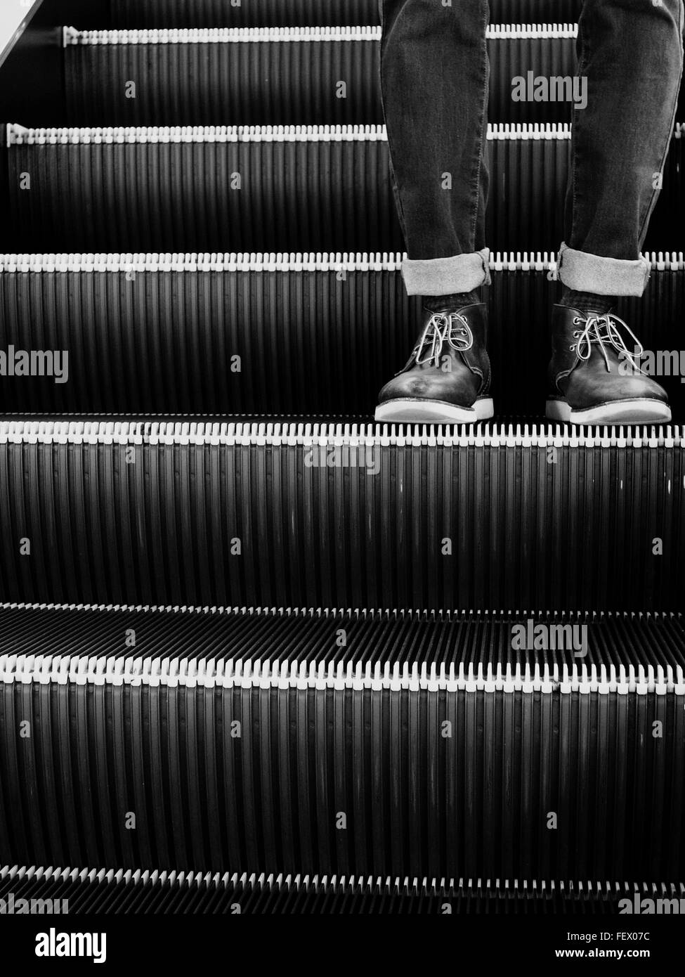 Man Moving Down To Escalator Stock Photo - Alamy