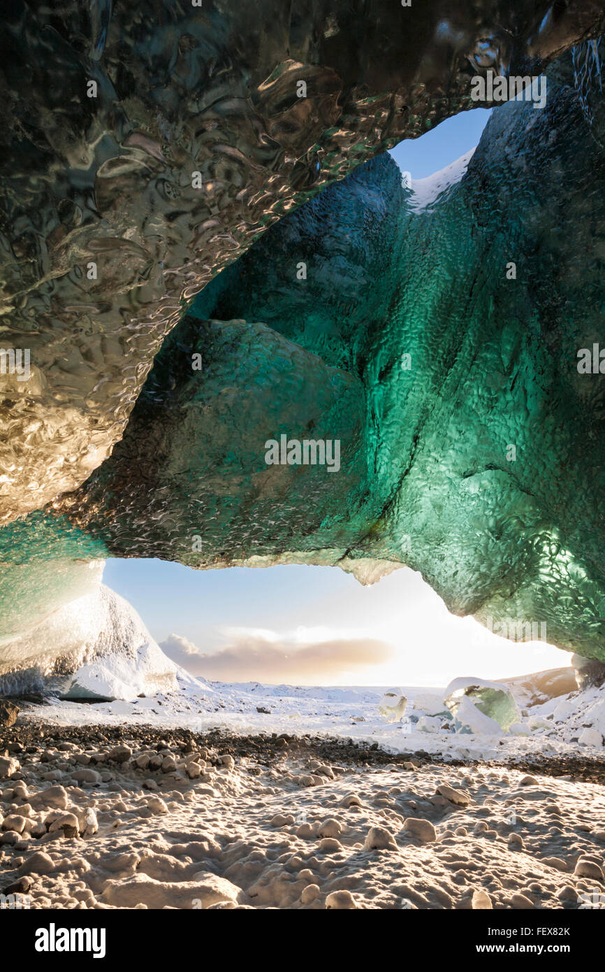 Inside ice cave looking out at Breidamerkurjokull Breiðamerkurjökull Ice Cave, Crystal Cave in Vatnajökull National Park South East Iceland in January Stock Photo