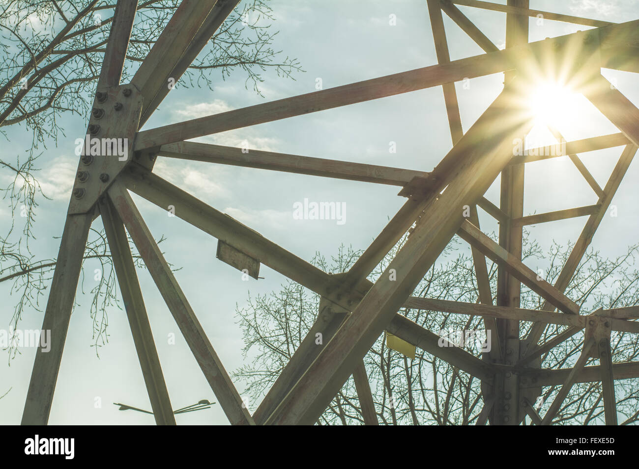 Power pole with high voltage against the blue sky Stock Photo - Alamy