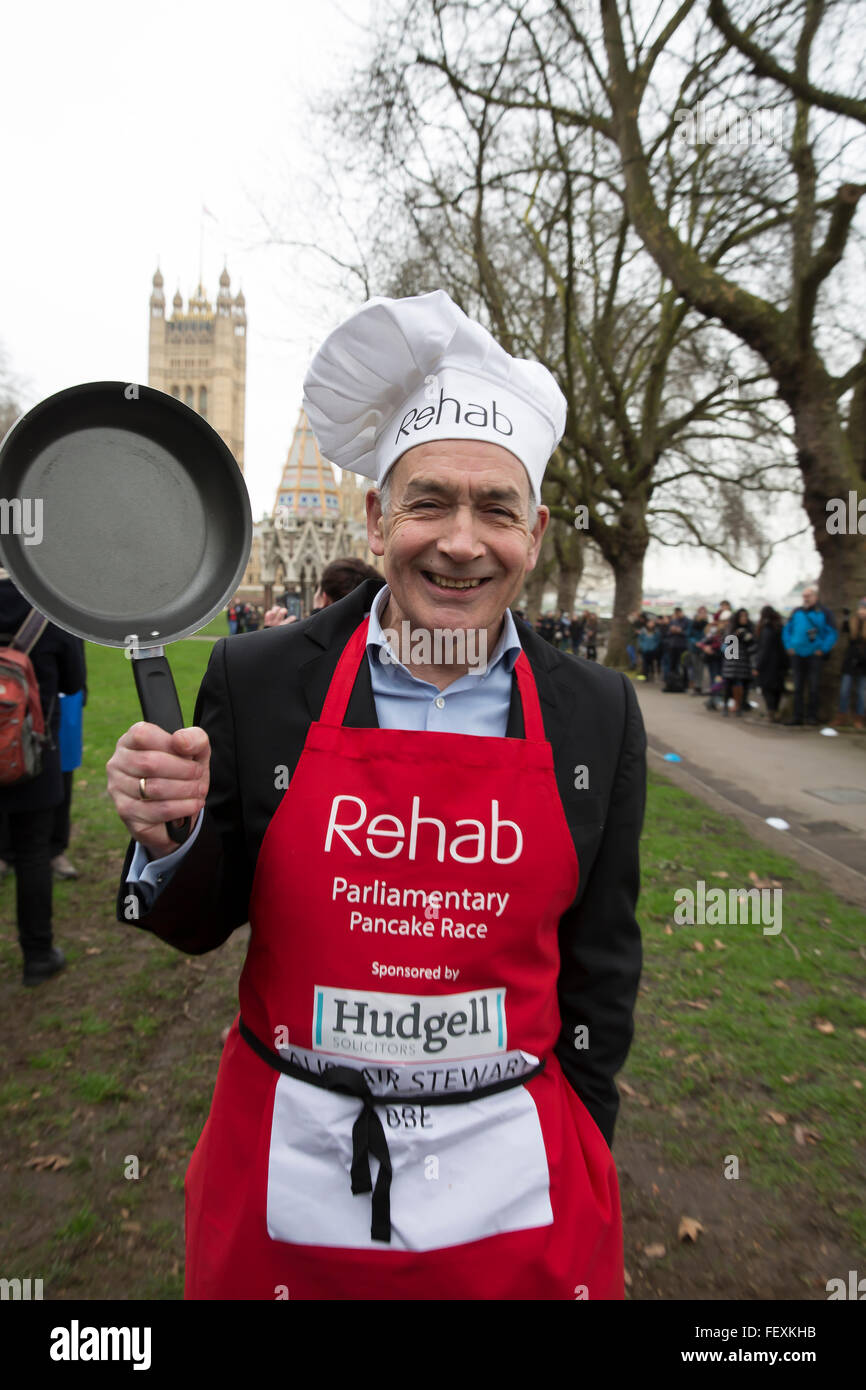 Westminster, London, UK. 9th February 2016. Alastair Stewart OBE, ITV news, poses with his frying pan at the Rehab Parliamentary Pancake Race 2016 Credit:  Keith Larby/Alamy Live News Stock Photo