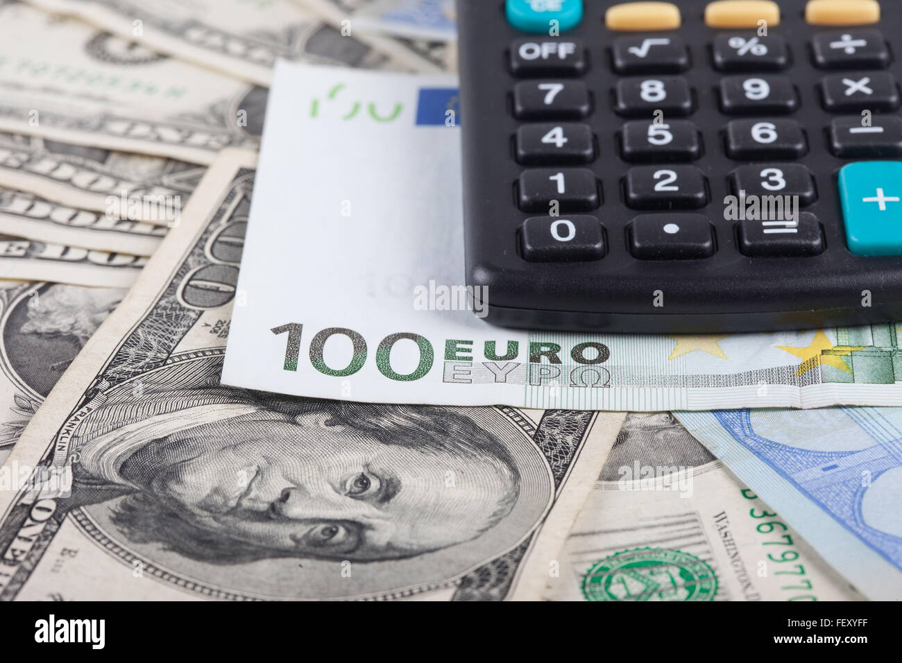calculator and banknotes of dollars, euro background Stock Photo