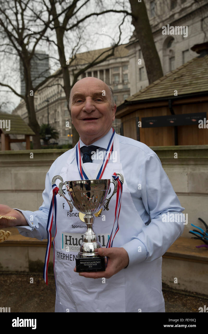 Westminster, London, UK. 9th February 2016. Stephen Pound MP for Ealing North poses with the winners cup at the Rehab Parliamentary Pancake Race 2016 Credit:  Keith Larby/Alamy Live News Stock Photo