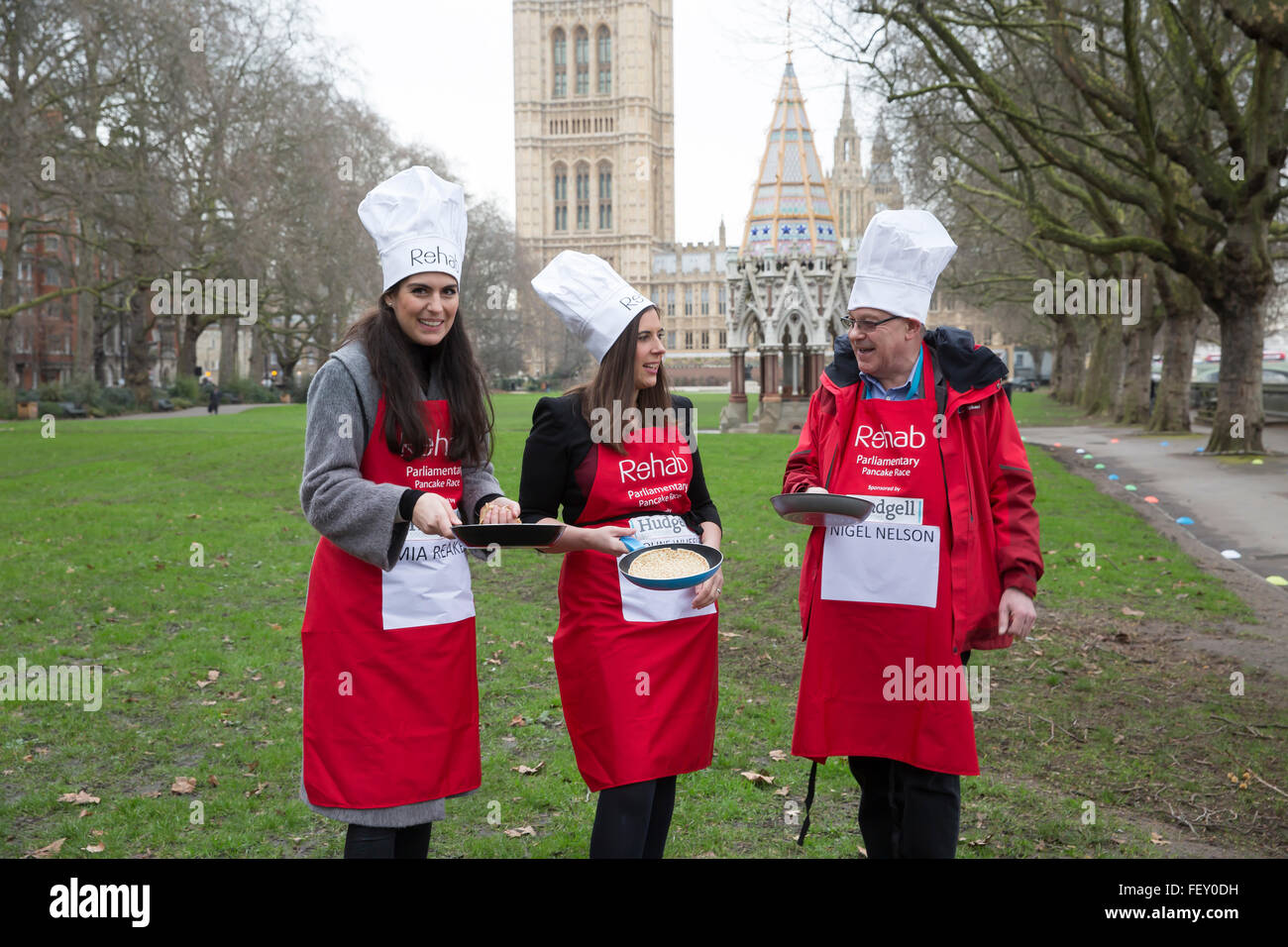 Westminster, London, UK. 9th February 2016. Mia Reakes, Caroline Wheeler and Nigel Nelson pose with their frying pans at the Rehab Parliamentary Pancake Race 2016 Credit:  Keith Larby/Alamy Live News Stock Photo