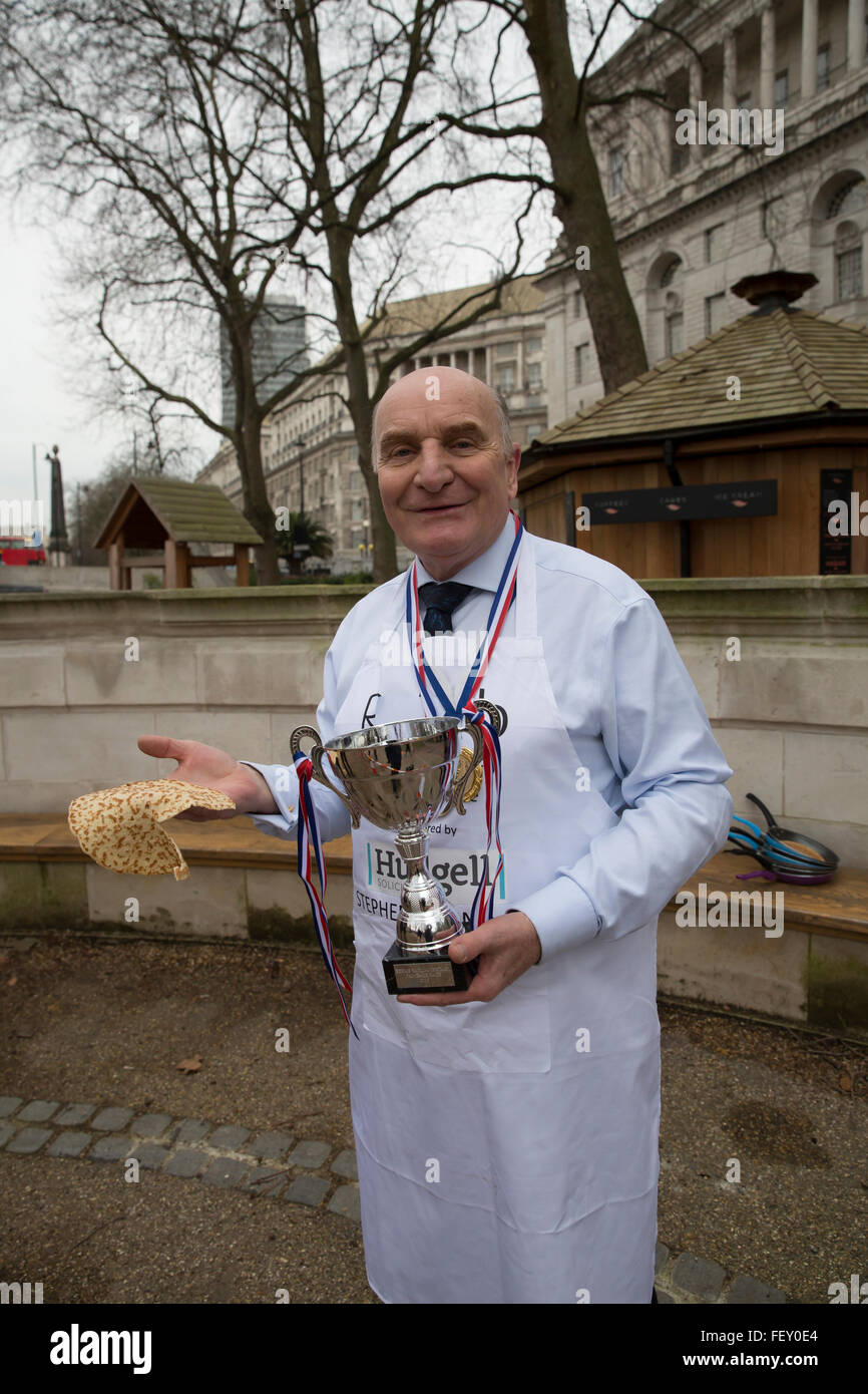Westminster, London, UK. 9th February 2016. Stephen Pound MP for Ealing North poses with a pancake and the winners cup at the Rehab Parliamentary Pancake Race 2016 Credit:  Keith Larby/Alamy Live News Stock Photo