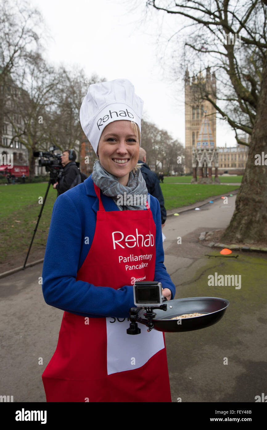 Westminster, London, UK. 9th February 2016. Sophy ridge, Sky news, poses with her go pro frying pan at the Rehab Parliamentary Pancake Race 2016 Credit:  Keith Larby/Alamy Live News Stock Photo