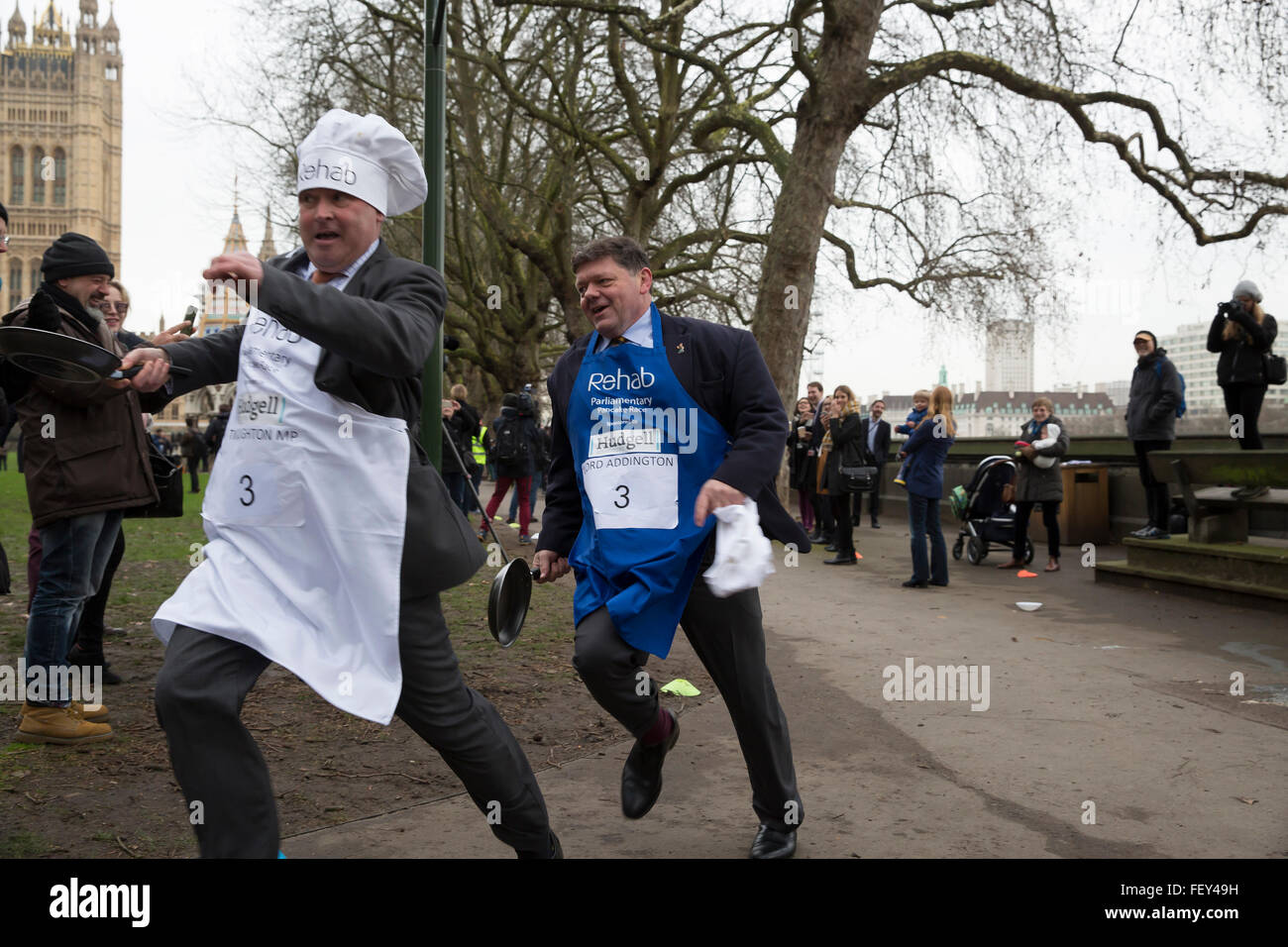 Westminster, London, UK. 9th February 2016. Rehab Parliamentary Pancake Race 2016 takes place as runners representing the House of Commons, the House of Lords and the Parliamentary Press Gallery race against each other while tossing pancakes Credit:  Keith Larby/Alamy Live News Stock Photo