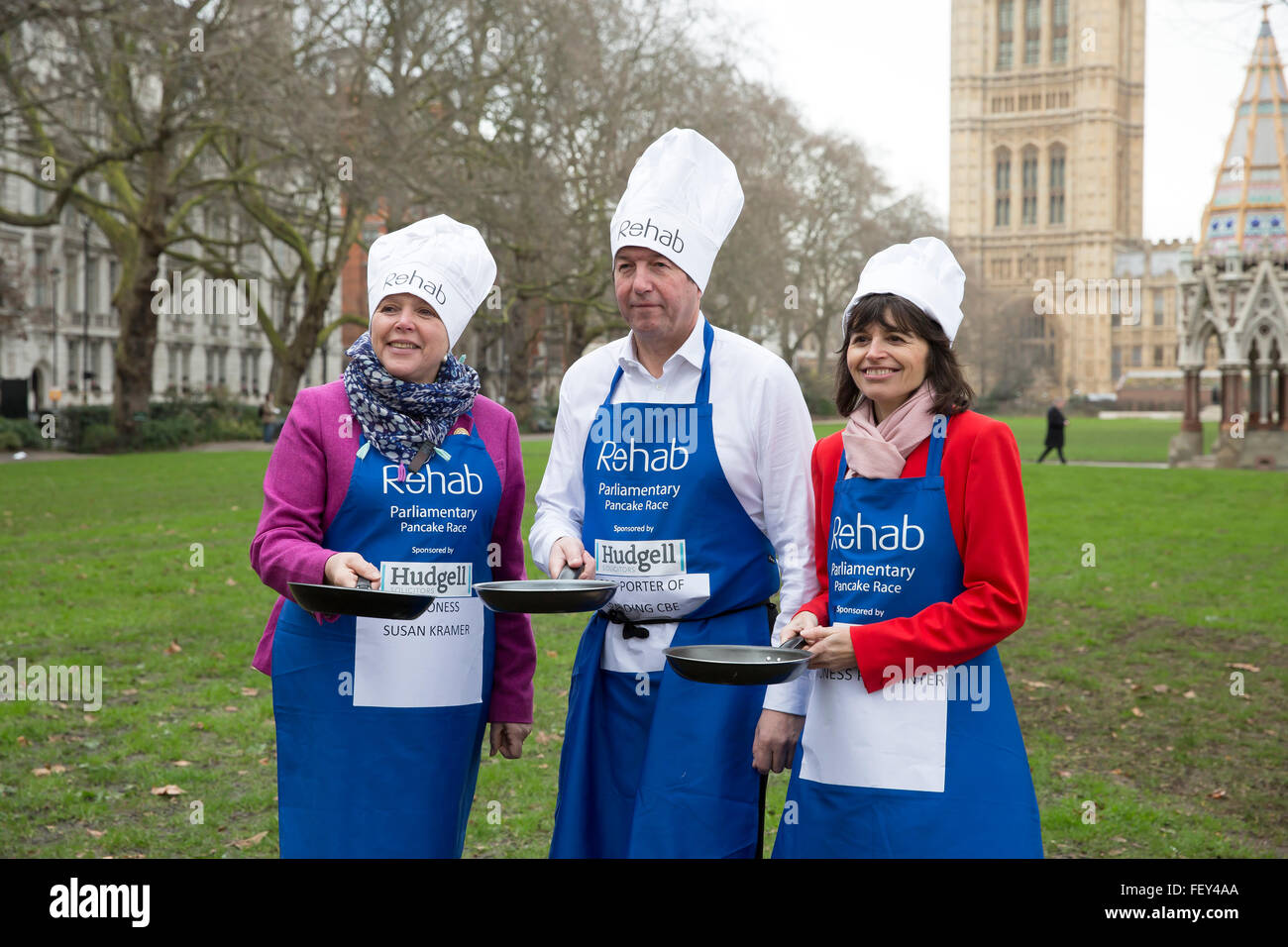 Westminster, London, UK. 9th February 2016. Baroness Susan Kramer, Lord Porter of Spalding and Baroness Parminter pose with their frying pans at the Rehab Parliamentary Pancake Race 2016 Credit:  Keith Larby/Alamy Live News Stock Photo
