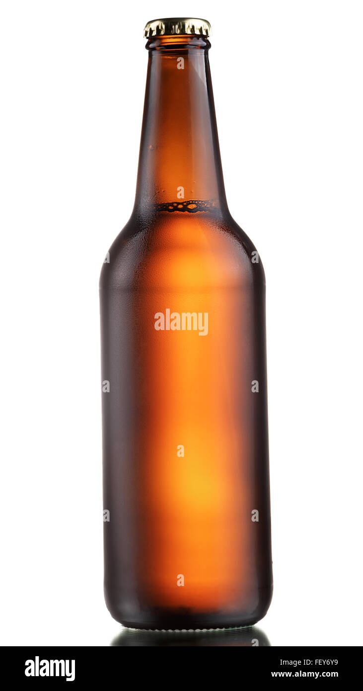 Full, sealed brown bottle of dark beer with drops. Matt appearance