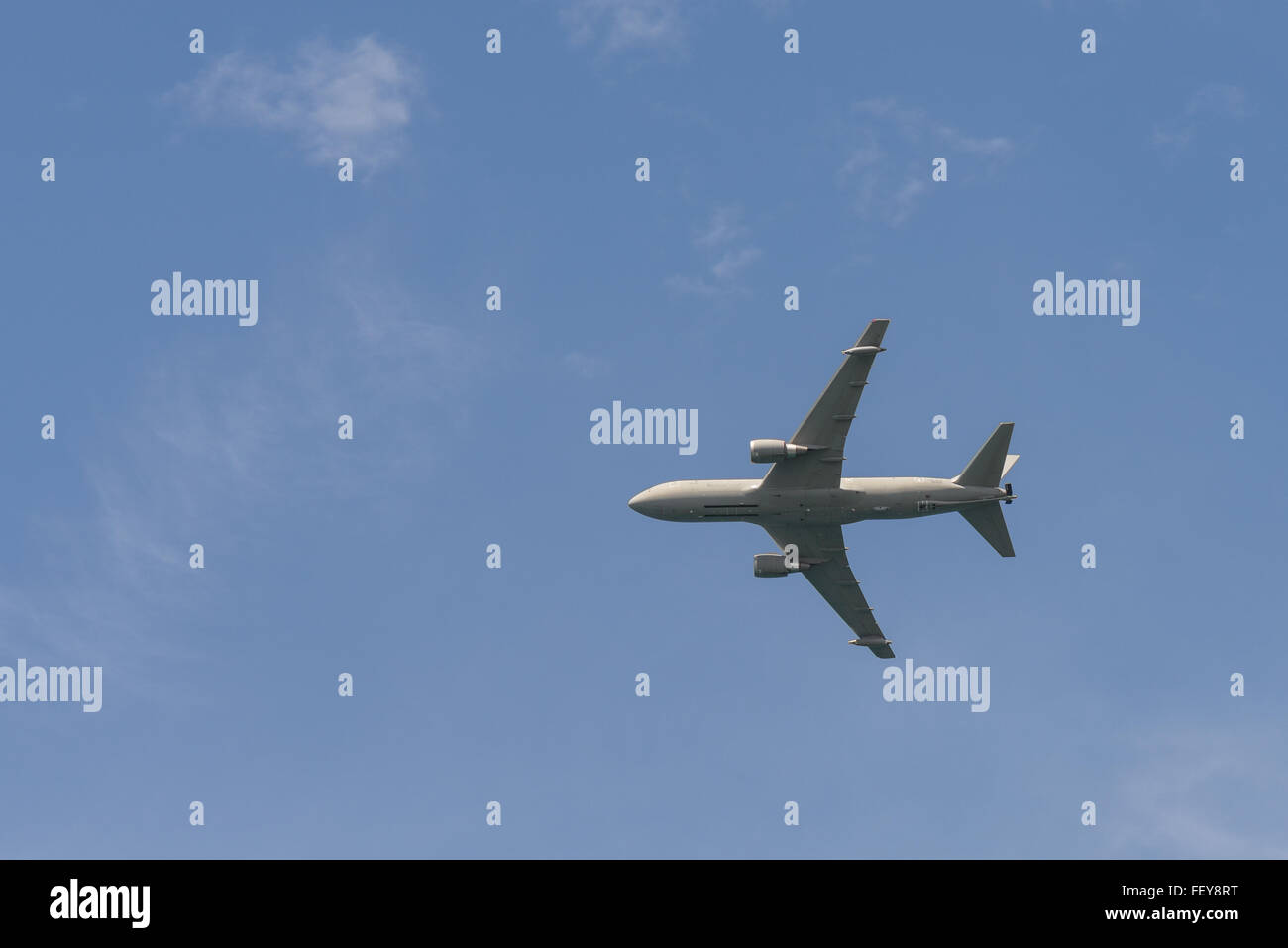 airplane jet flying in a blue sky Stock Photo