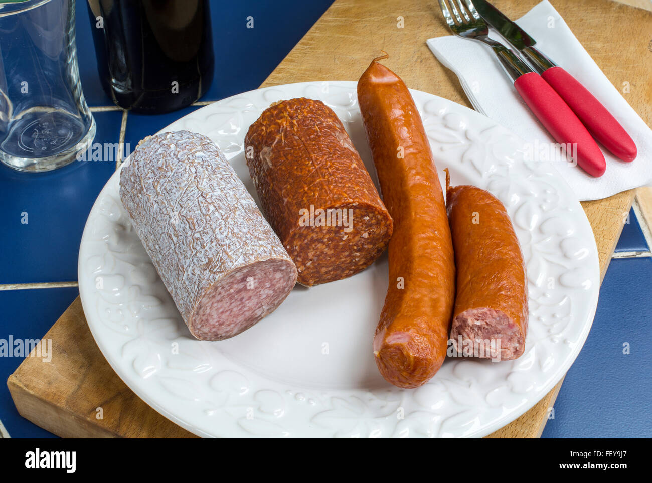 Three European sausages mild salami, pepper salami and kabanossi