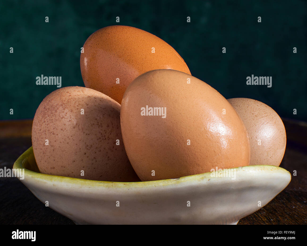 Different colors of four hen's eggs. Stock Photo