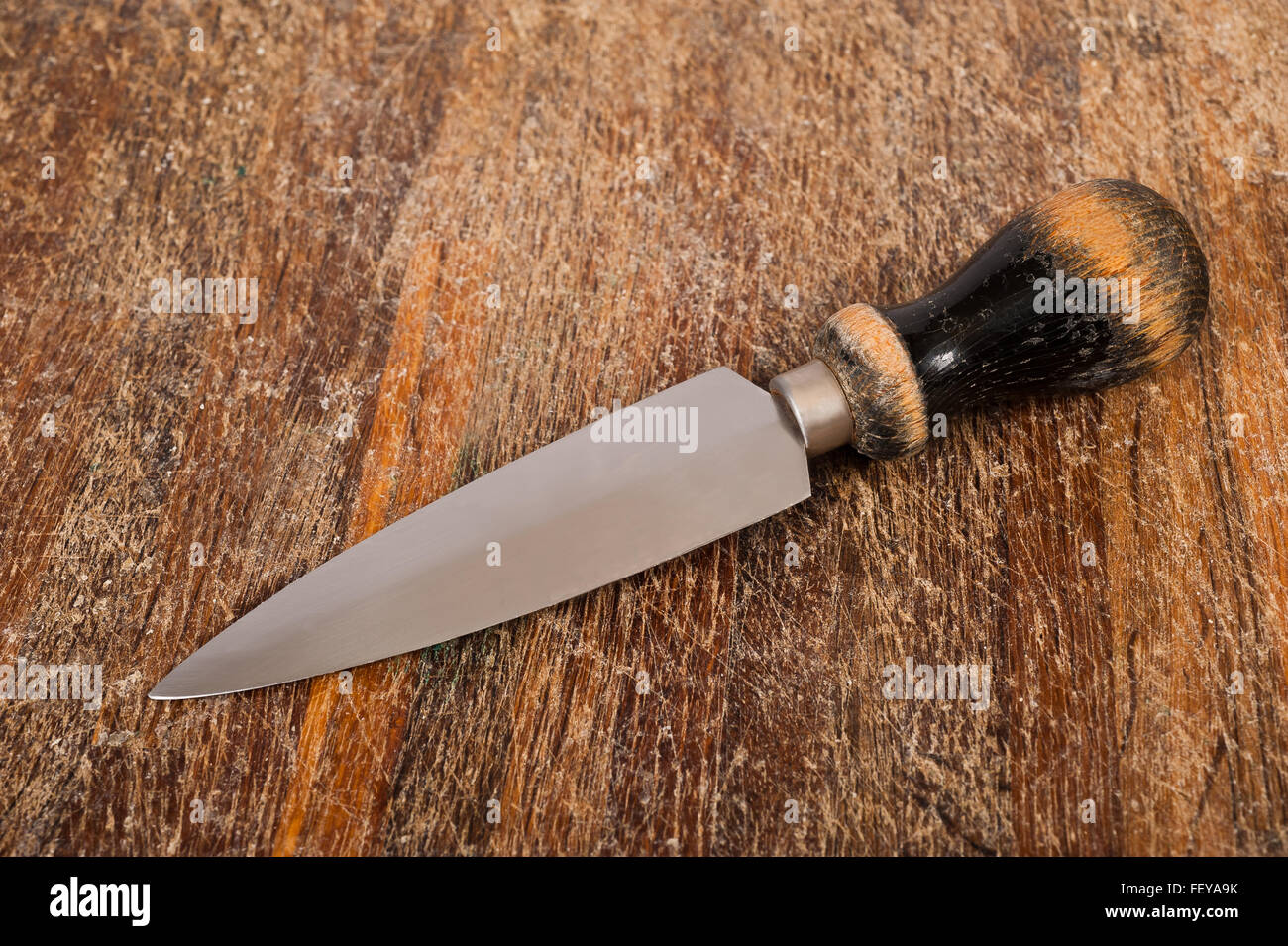 Old knife on wood background Stock Photo