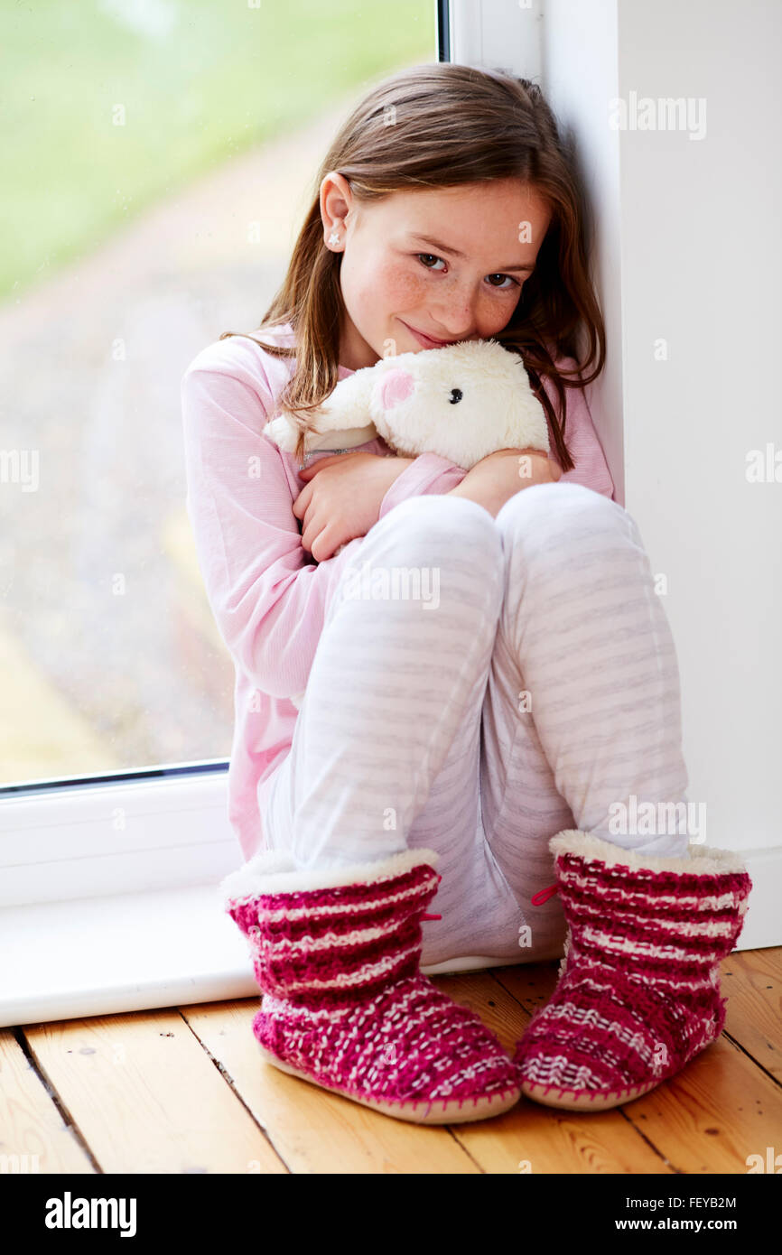 Little girl sat smiling Stock Photo