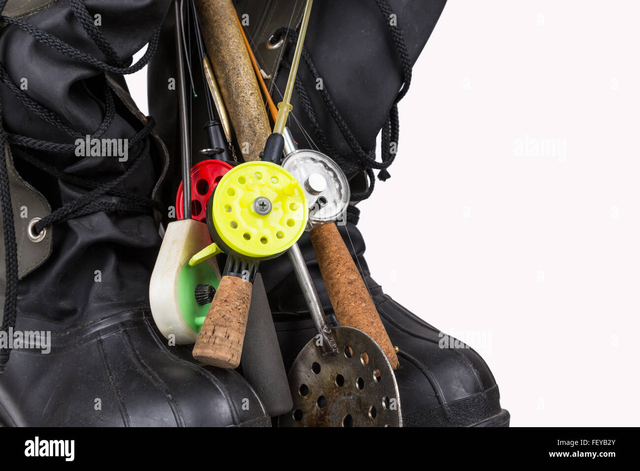 ice fishing tackles and winter boots on white background Stock Photo