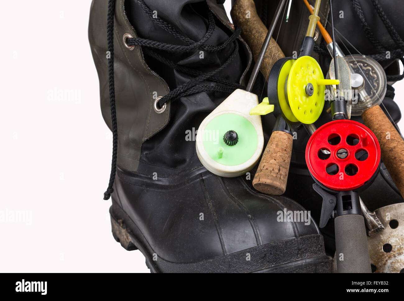 ice fishing tackles and winter boots on white background Stock Photo