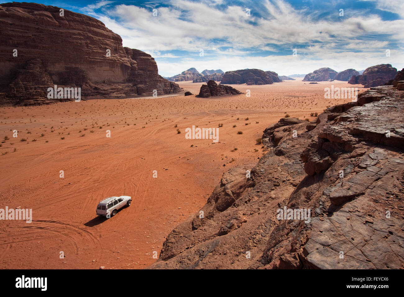 Anonymous car in the sand of Wadi Rum reservation, Jordan. Stock Photo