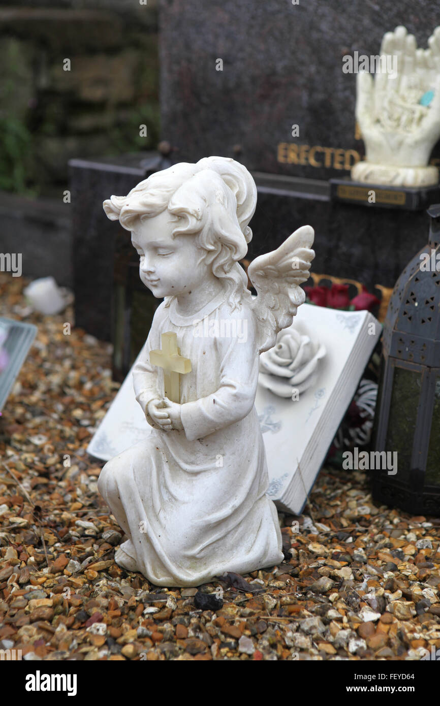 White little angel on a grave in rural Ireland Stock Photo