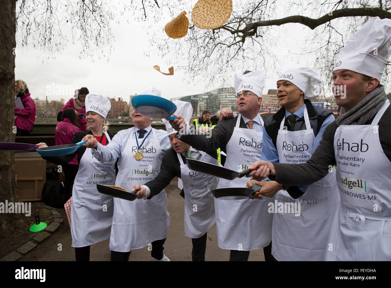 Westminster, London, UK. 9th February 2016. MP'S team celebrate after winning the Rehab Parliamentary Pancake Race 2016 as runners representing the House of Commons, the House of Lords and the Parliamentary Press Gallery raced against each other while tossing pancake Credit: Keith Larby/Alamy Live News Stock Photo