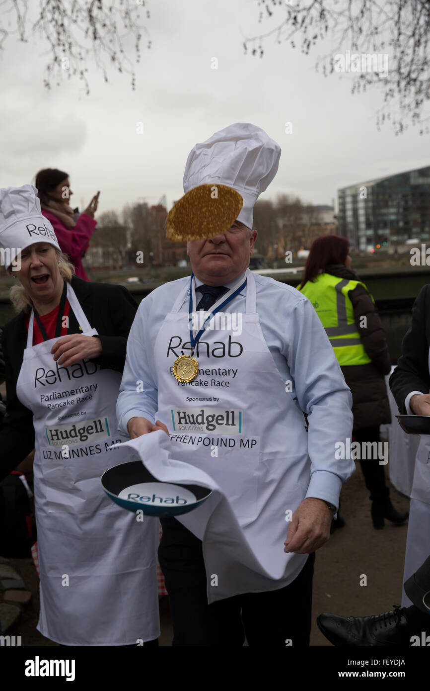 Westminster, London, UK. 9th February 2016. Stephen Pound MP for Ealing North tosses a pancake  at the Rehab Parliamentary Pancake Race 2016 Credit:  Keith Larby/Alamy Live News Stock Photo